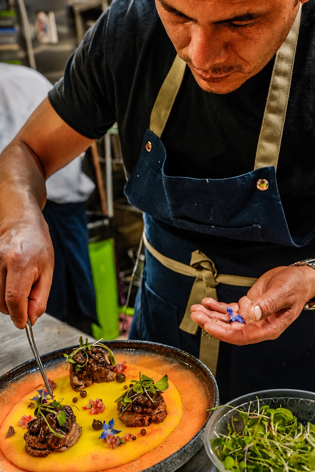 The chef finishing a MARE dish